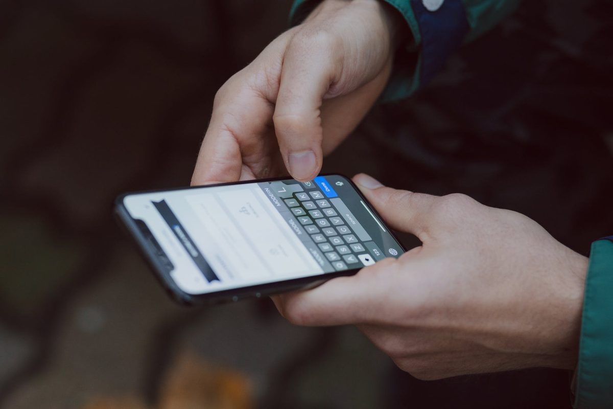 person holding iphone x